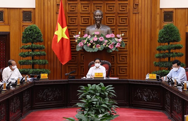 越南政府总理范明政：编制处置疫情的各种应急预案 hinh anh 1