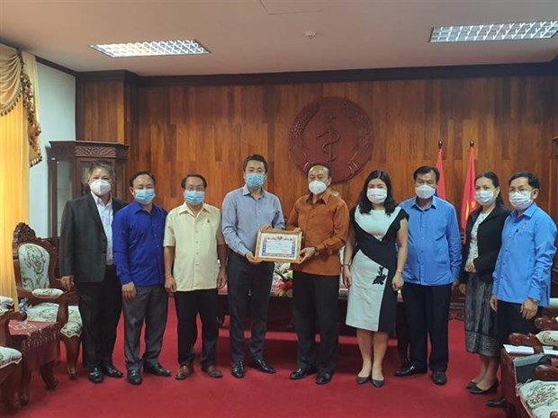 新冠肺炎疫情：在老越南人社群同老挝政府携手共同抗击疫情 hinh anh 1
