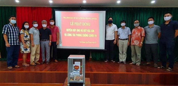 越南驻柬埔寨西哈努克省总领事馆举行新冠疫苗基金捐赠活动启动仪式 hinh anh 1