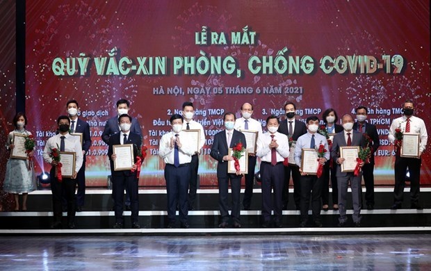 越南人民携手努力充实疫苗基金会 决不让任何人掉队 hinh anh 1