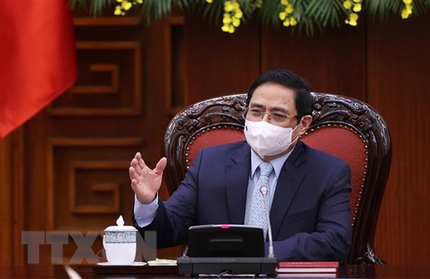 政府总理范明政：越南疫情防控工作取得积极成果 hinh anh 1