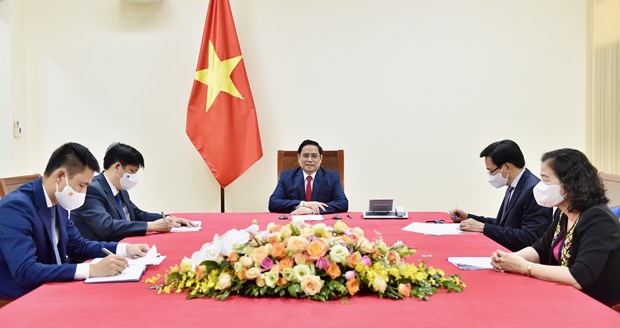 越南政府总理范明政建议世卫组织援助越南成为疫苗生产中心 hinh anh 1