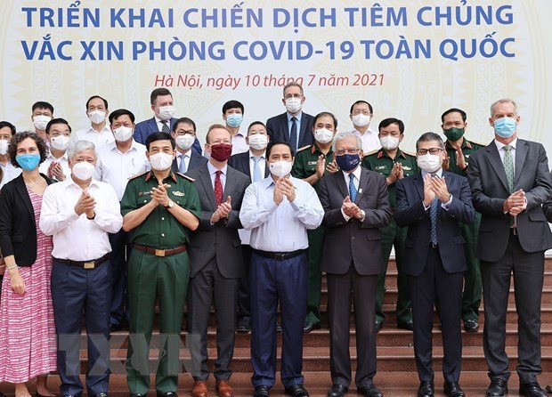 越南政府总理范明政：许多人希望优先为疫情重灾区进行新冠疫苗接种 hinh anh 2