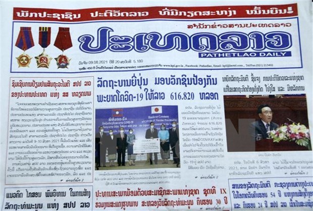 老挝媒体重点报道越南国家主席阮春福访老之旅 hinh anh 1