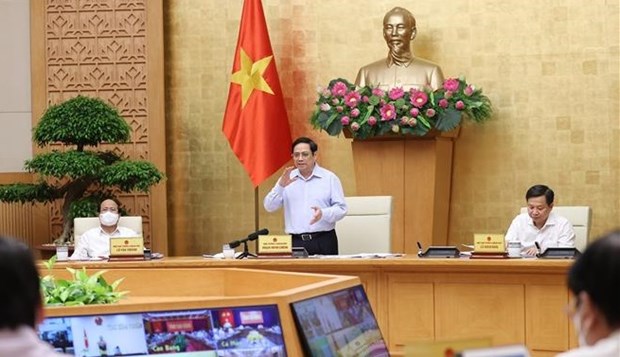 越南政府总理范明政：9月份越南国产新冠疫苗或将上市 hinh anh 1