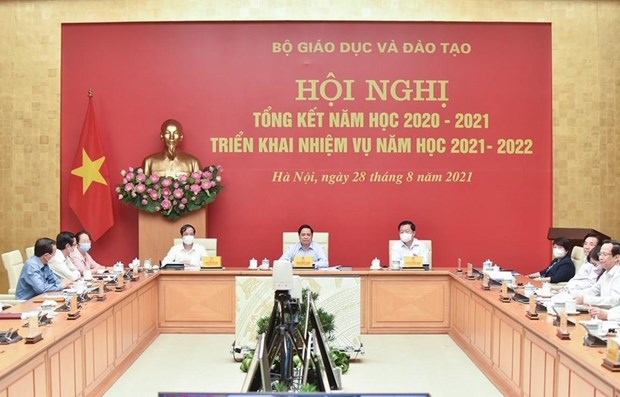 范明政总理：将确保2021-2022学年学校安全与新冠疫苗接种相结合 hinh anh 1