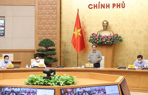 越南政府总理：全国各地统一安全适应和有效控制疫情 hinh anh 1
