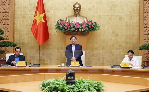越南政府总理范明政主持政府与工会工作关系会议 hinh anh 1