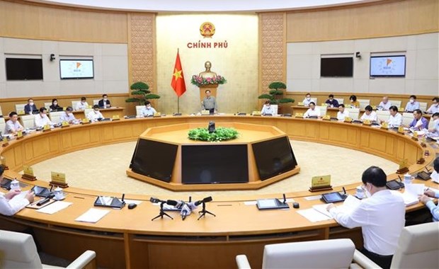 越南政府总理范明政主持召开2021年10月政府例行会议 hinh anh 1