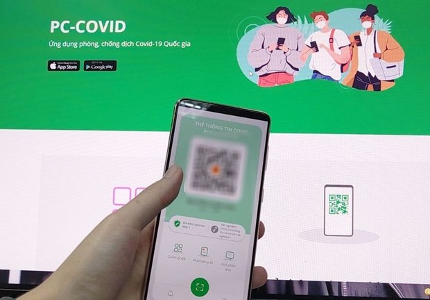胡志明市使用PC-COVID应用参与社会经济活动 hinh anh 1