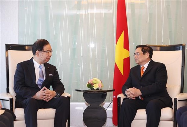越南政府总理范明政会见日本共产党和公明党领导 hinh anh 1