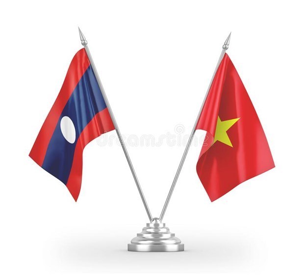 越南外交部代表团赴老挝驻越南大使馆庆祝国庆46周年 hinh anh 1