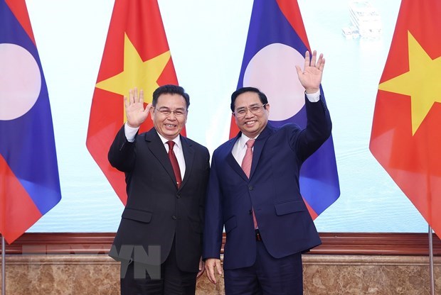越南政府总理范明政会见老挝国会主席赛宋蓬·丰威汉 hinh anh 1