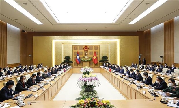 政府总理范明政主持仪式 欢迎老挝政府总理潘坎·维帕万访问越南 hinh anh 2