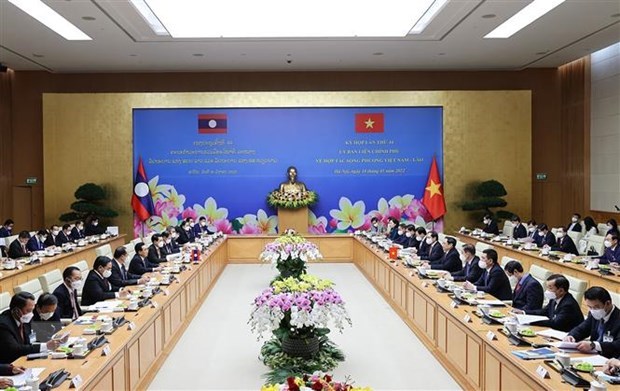 越南与老挝加强两个经济体的全面对接 hinh anh 1