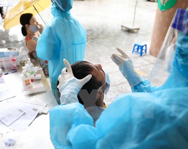 2月3日越南报告新增确诊病例8601例 新增治愈病例超2.5万例 hinh anh 1