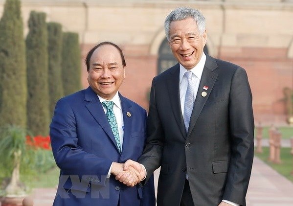 新加坡媒体高度评价越南国家主席阮春福的国事访问 hinh anh 1