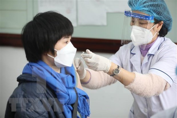 26日越南新增确诊病较前一日下降近6千例 新增治愈病例超16.4万例 hinh anh 1