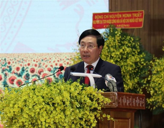 国家统一47周年：越南政府常务副总理范平明出席禄宁解放日50周年 hinh anh 1