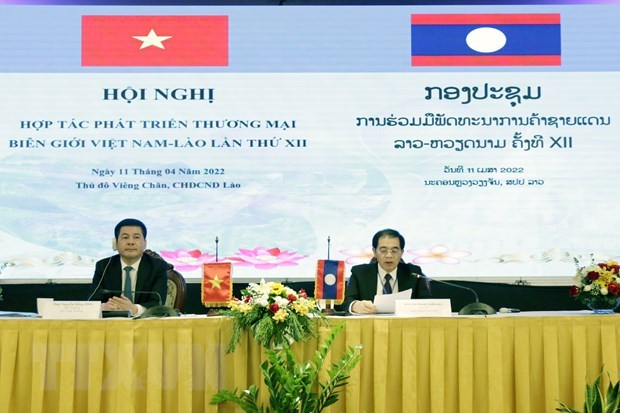 越南与老挝加强边境贸易合作 hinh anh 1