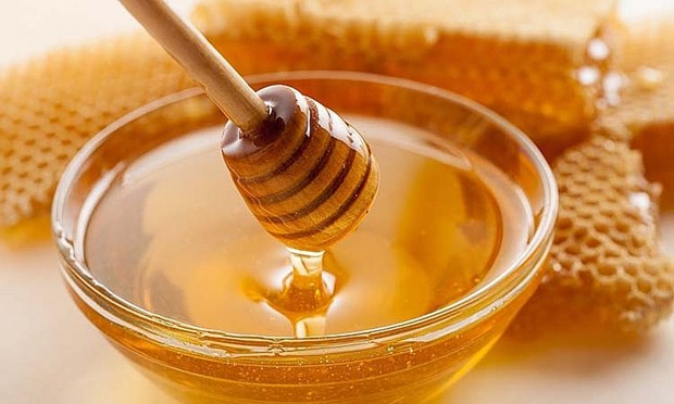 美国商务部将越南蜂蜜反倾销税下调近7倍 hinh anh 1