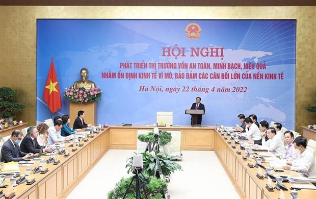 越南政府总理范明政主持召开资本市场安全发展会议 hinh anh 1