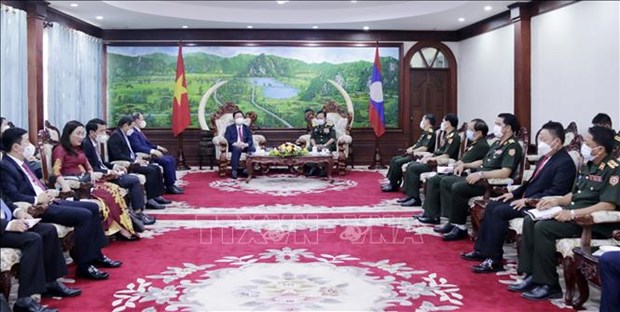 老挝党和国家领导人会见越共中央宣教部代表团 hinh anh 3