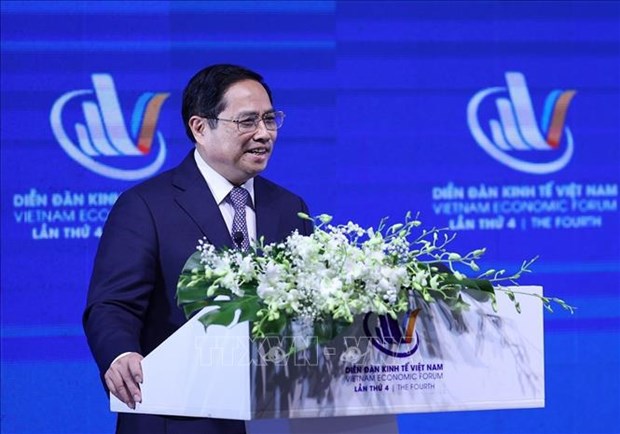 越南政府总理范明政：越南坚定革新开放，主动积极深度融入国际社会 hinh anh 1