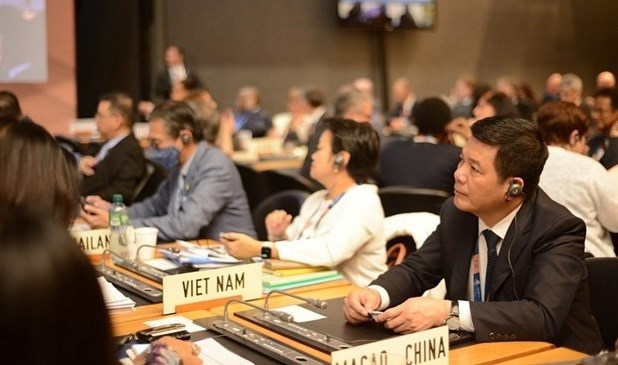 越南工贸部部长阮鸿延率团出席世贸组织第十二届部长级会议 hinh anh 1