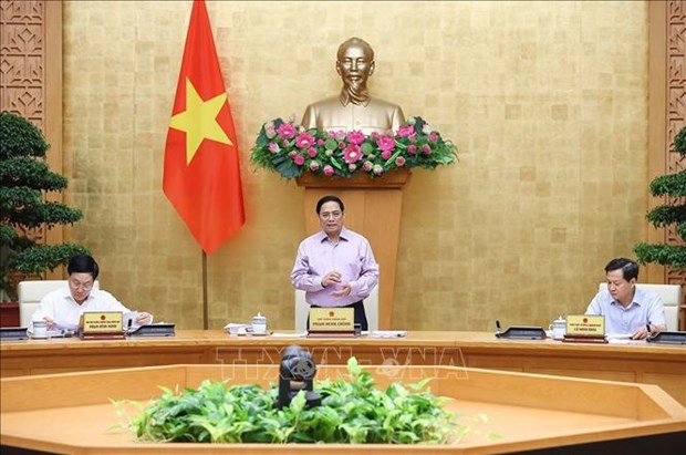 越南政府总理范明政主持政府立法工作会议 hinh anh 1