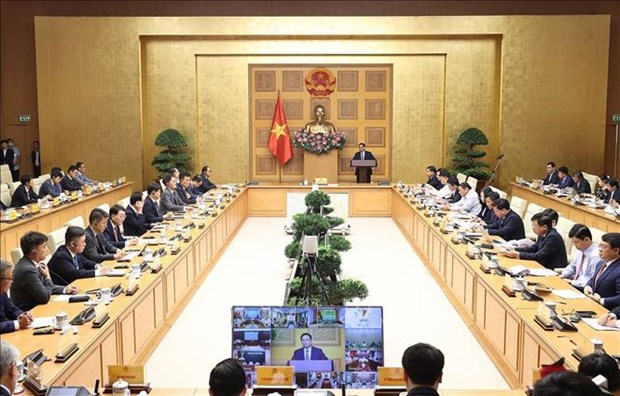 越南政府总理范明政与韩国企业代表举行对话会 hinh anh 1