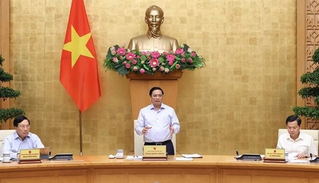 越南政府总理范明政：经济社会发展管理按照四稳定、三加强、二促进、一减少和一杜绝精神进行 hinh anh 2