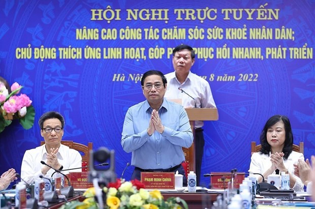 越南政府总理范明政:各部门、行业和地方全力解决卫生部门的紧迫性问题 hinh anh 1