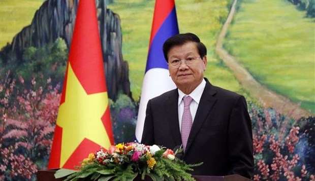 越老建交60周年：老挝人民革命党中央总书记、国家主席通伦呼吁两国人民继续保护和培育老越特殊关系 hinh anh 1