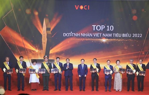 越南政府总理范明政出席2022年越南十名优秀企业家表彰会 hinh anh 1