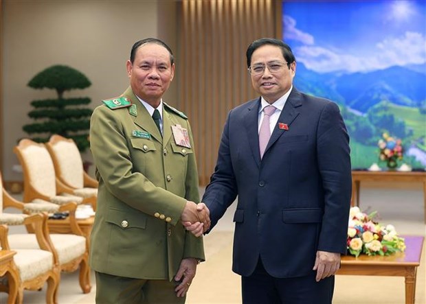越南政府总理范明政会见老挝副总理兼公安部部长维莱·拉坎丰 hinh anh 1