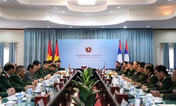越老建交60周年：越南人民军总政治局主任率团访问老挝 hinh anh 2