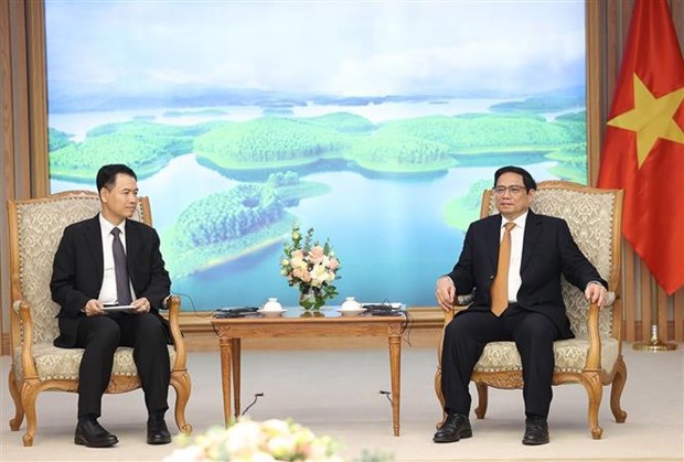 政府总理范明政会见老挝工贸部部长马来通·康马西 hinh anh 1