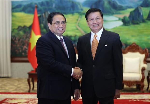 越南政府总理拜会老挝人民革命党总书记国家主席 hinh anh 1