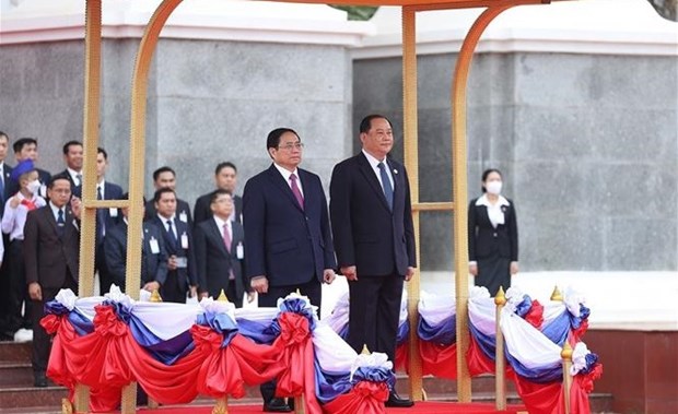 越南政府总理范明政开始对老挝进行正式访问 hinh anh 3