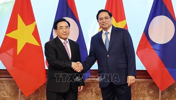 政府总理范明政对老挝进行正式访问：进一步促进越老两国之间的合作 hinh anh 2