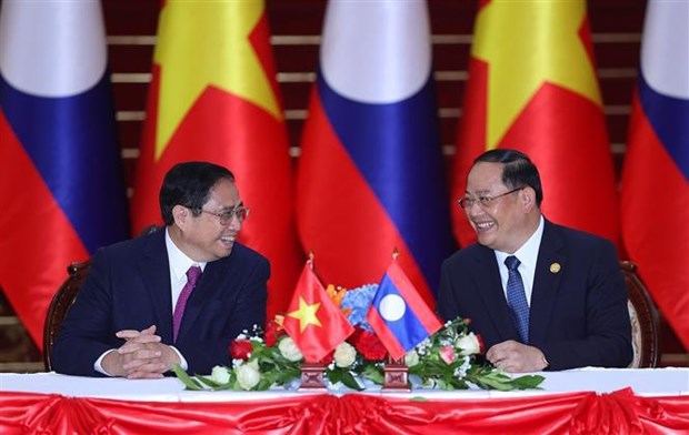 越南政府总理范明政圆满结束对老挝的正式访问 hinh anh 2
