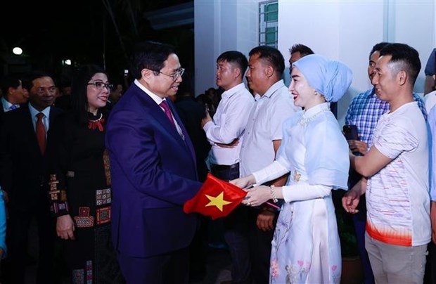 越南政府总理范明政与旅居文莱越南人社群举行见面会 hinh anh 2