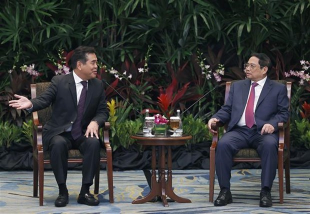 越南政府总理范明政会见新加坡各大企业领导 hinh anh 2