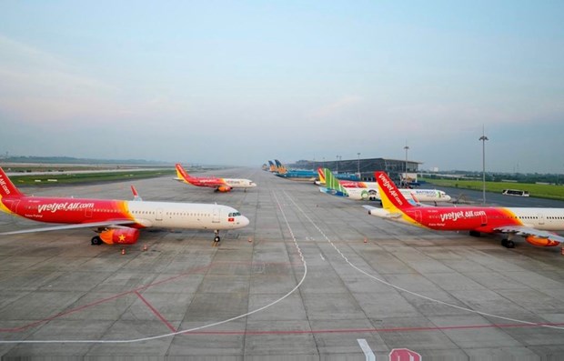 越南各家航空公司将飞往中国的航班开放时间推迟到2023年4月底 hinh anh 1