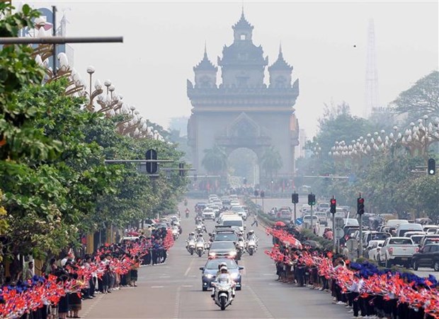 旅老越南人社群相信越南国家主席访问老挝之旅将密切两国团结友好关系 hinh anh 2