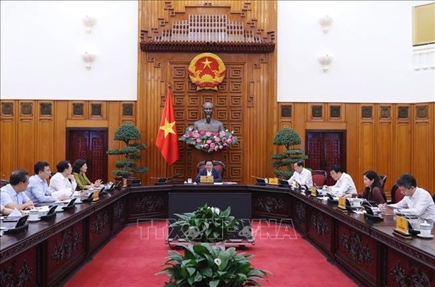 越南政府总理范明政：促进颁布有关债务重组和公司债券的两项通知 hinh anh 2