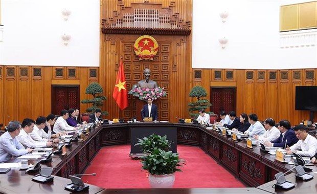越南政府总理范明政：国家为企业和人民提供鼎力支持 hinh anh 2
