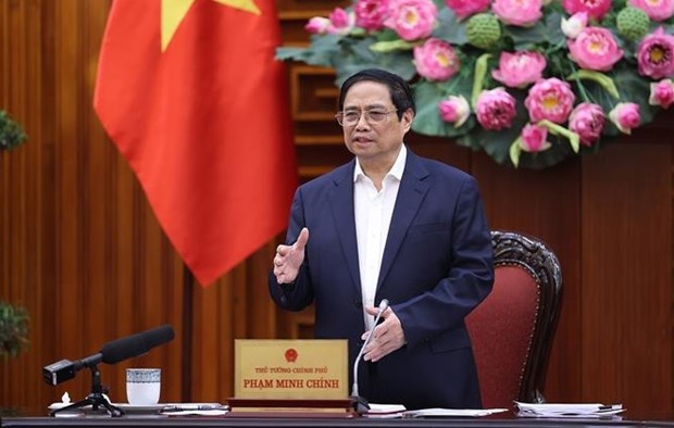越南政府总理范明政：国家为企业和人民提供鼎力支持 hinh anh 1