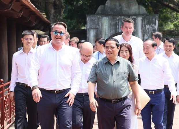 越南政府总理范明政与卢森堡大公国首相格扎维埃·贝泰尔举行会谈 hinh anh 4